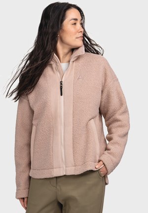 Beige Fleece-Jacke mit durchgehendem Reißverschluss, hohem Kragen und Seitentaschen. Sie zeichnet sich durch eine weiche Textur und ein minimalistisches Logo auf der Brust aus.