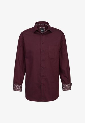 Camicia a maniche lunghe color bordeaux con colletto classico, chiusura con bottoni davanti, taschino sul lato sinistro del petto e dettagli floreali a stampa sui polsini.