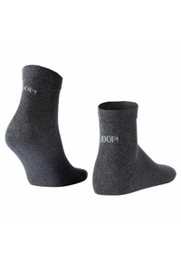 Calcetines tobilleros en gris oscuro, hechos de un textil suave, con un puño acanalado y un pequeño logo impreso en gris claro en el costado.