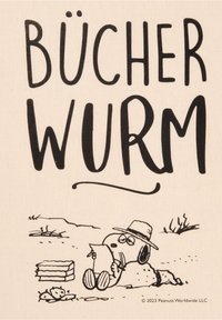 Stampa su tela con un testo nero audace "BÜCHERWURM" sopra un personaggio dei cartoni animati che legge su una superficie sabbiosa, con un gruppo di libri nelle vicinanze.