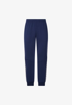 Pantaloni sportivi blu navy con vita elasticizzata, polsini affusolati e dettagli laterali decorati in colori a contrasto. Tessuto liscio in misto cotone.