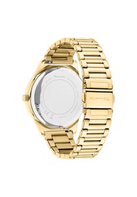 Gold stainless steel watch featuring a linked bracelet, rounded case, and a polished silver back displaying brand and water resistance details.