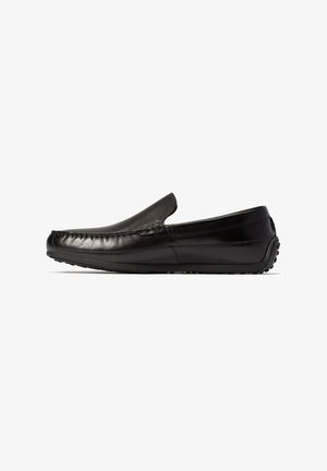 Schwarze Leder-Loafers mit glatter Oberfläche, rundem Zehenbereich und Schlupfdesign. Verfügen über dezente Nähte und eine strukturierte Gummisohle.