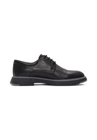 Zwarte leren schoenen met een gladde afwerking, voorzien van een ronde neus, zes veterogen en een gestructureerde rubberen zool met een contrasterende witte accent.