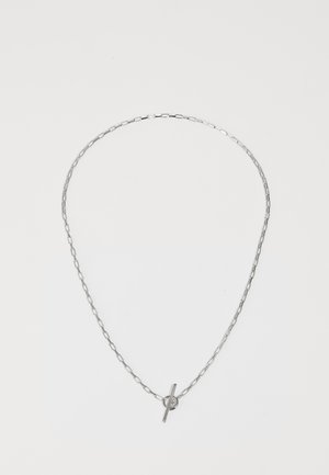 Die silberne Kettenhalskette verfügt über verlängerte Glieder, einen polierten Stangenverschluss und ein kreisförmiges Akzentstück. Das Design ist minimalistisch und elegant.