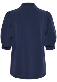 Navy blue polo shirt with short puff sleeves, a collar, and a smooth texture. Features a relaxed fit and a curved hem at the bottom.