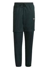 Pantaloni sportivi verde scuro con vita elasticizzata, cordino regolabile, tasche laterali con zip e un'etichetta con logo a contrasto sulla coscia.