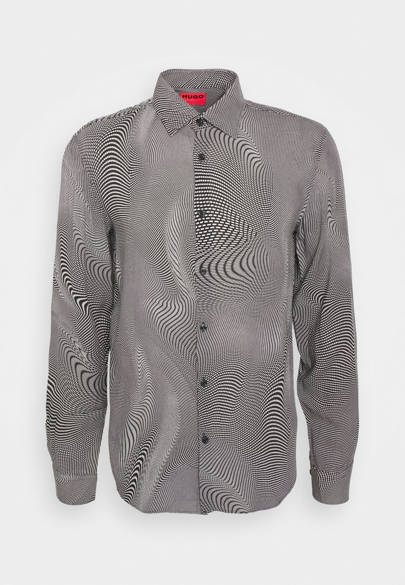 Camicia a maniche lunghe con un motivo vorticoso in bianco e nero, apertura con bottoni frontale, colletto e bottoni neri per la chiusura. Tessuto leggero.