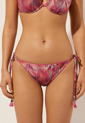 Bunt bedruckter Bikini-Boden in Pink-, Lila- und Grüntönen. Mit seitlichen Ties und Quasten. Glatte Textur.
