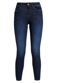Jeans ajustados en denim azul oscuro, con una cintura alta, bolsillos frontales y costuras naranjas. Textura suave con un ligero estiramiento.