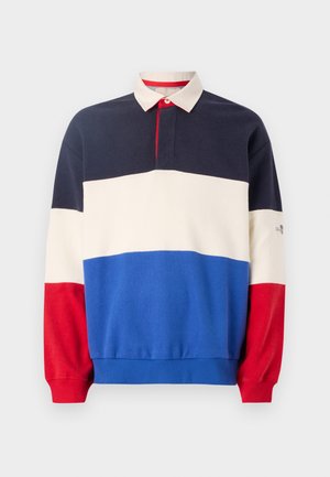 Polo mikina s barevným blokováním v námořnické modré, krémové, modré a červené části. Obsahuje límeček, zapínání na knoflíky a žebrované manžety.