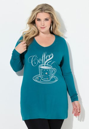 Langærmet tunika i blågrøn farve med et kaffekopgrafik, der har sølvdetaljer og tekst. Blødt stof, afslappet pasform og rund halsudskæring.