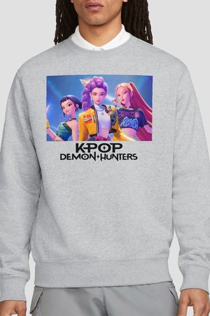 Sweatshirt with graphic of three animated female characters from K-Pop Demon Hunters, colorful outfits, and bold text below the image.