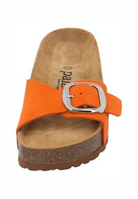 Orange suede slide sandal with a silver buckle. Cork midsole and textured footbed. Closed toe design and wide strap for comfort.