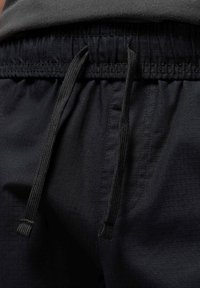 LOOSE FIT - Oldalzsebes nadrágok - black