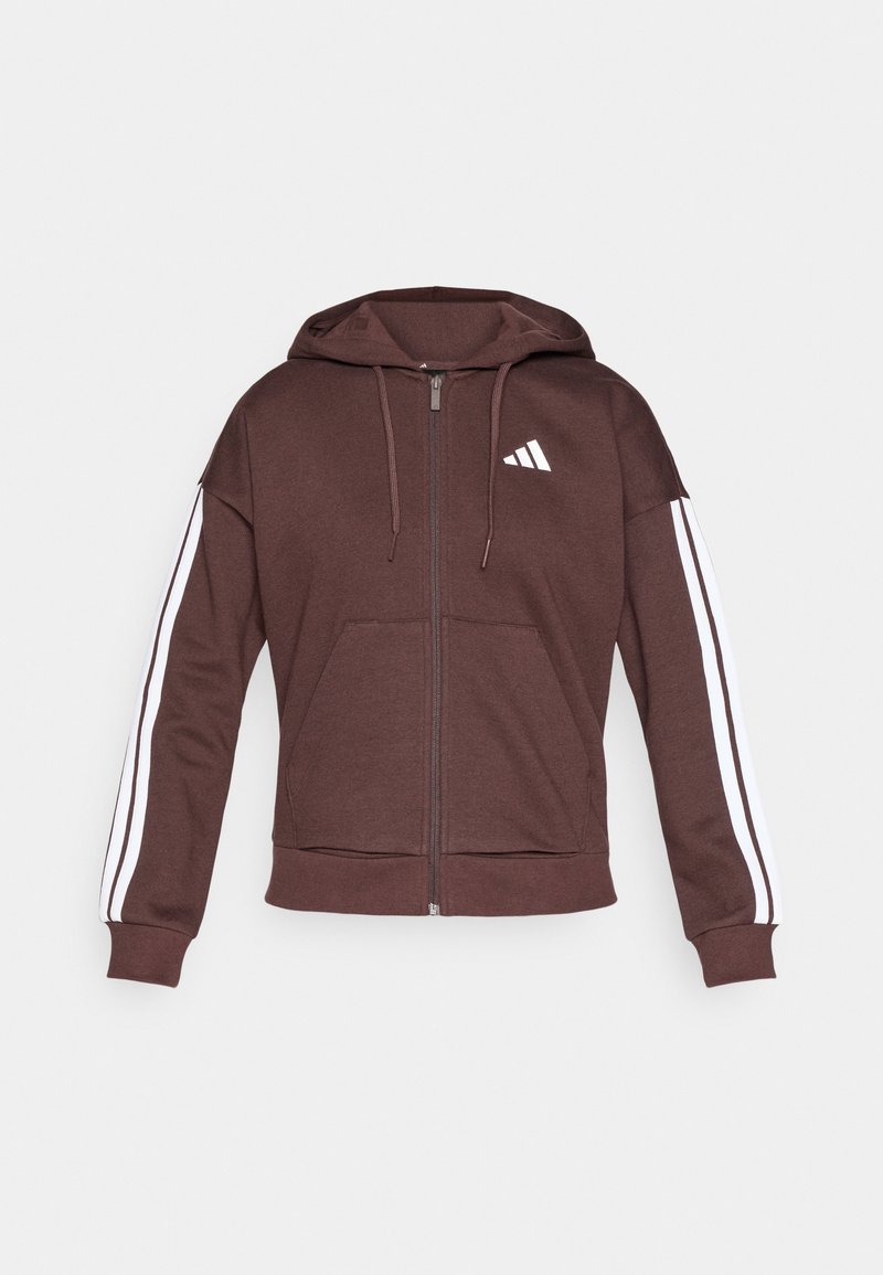 Bruine zip-up hoodie van zachte stof, met een grote voorzak, witte zijkanten en een klein wit logo op de borst.