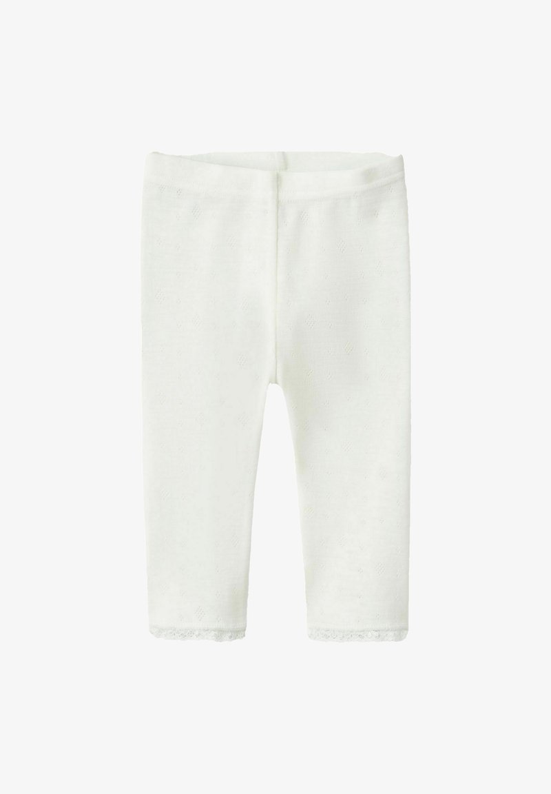 Leggings blancs en tricot avec un motif texturé, un tissu doux et une bordure en dentelle au bas des jambes. Dotés d'une ceinture élastique.