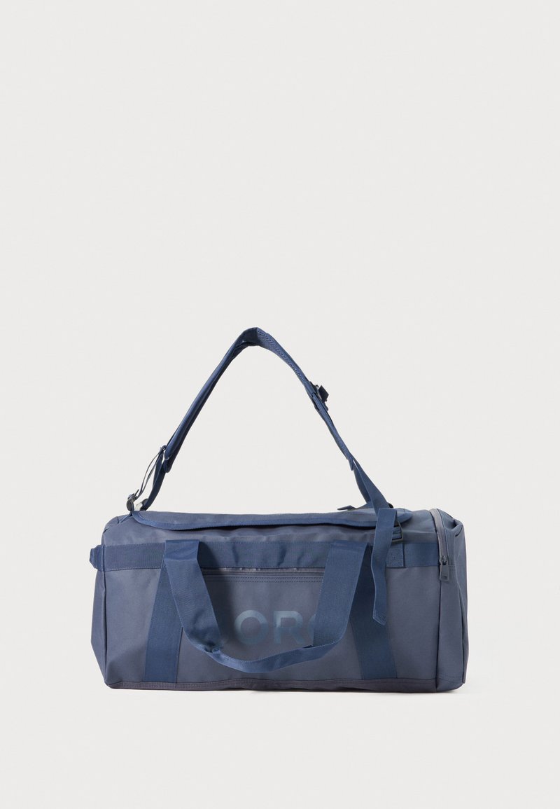Bolso de lona de la marina hecho de un tejido duradero, con dobles asas y una correa de hombro desmontable; bolsillo con cremallera en un lado.