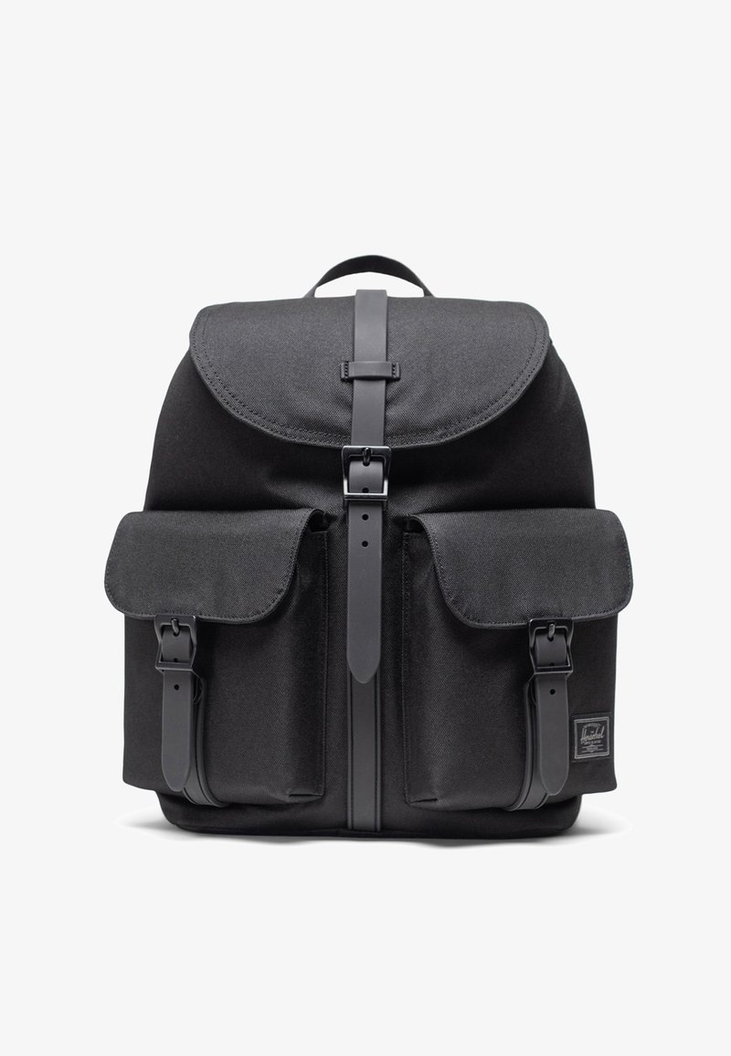 Black fabric backpack with a flap closure, featuring two front pockets with straps, a top handle, and a rectangular shape.