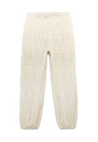 Hellbeige Hosen mit einem strukturierten Muster, gesmokten Bereichen und elastischen Bündchen, die für eine bequeme Passform entworfen wurden.