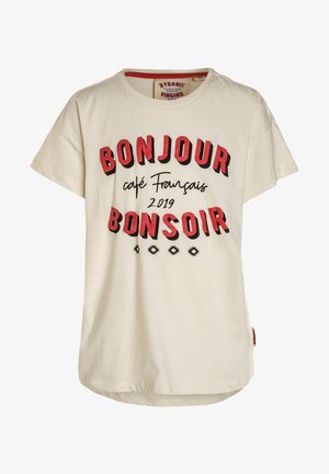 T-shirt beige à manches courtes avec texte rouge et noir "BONJOUR BONSOIR", "café Français", "2019" et motifs décoratifs en forme de losanges noirs.