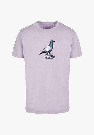 Light purple cotton t-shirt featuring a graphic of a pigeon standing on sneakers. Round neckline, short sleeves, and a relaxed fit.