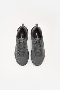 Dark grey athletic shoes with a mesh upper, padded collar, and lace closure. Textured detailing on the sides and a rubber sole.