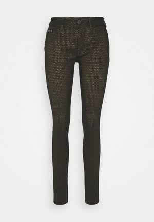 Schwarze, enge Jeans mit einem strukturierten goldenen Punktmuster; ausgestattet mit einem standardmäßigen Knopf- und Reißverschluss sowie einem Fünf-Taschen-Design.