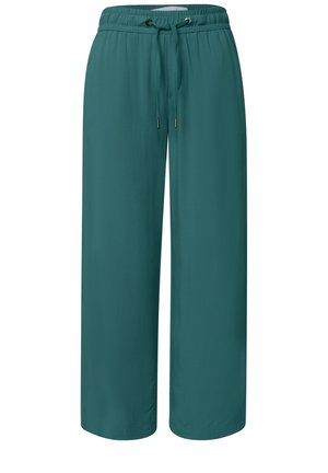 Pantalon large bleu sarcelle avec taille élastique et cordon, coupe ample et tissu lisse adapté pour une tenue décontractée.