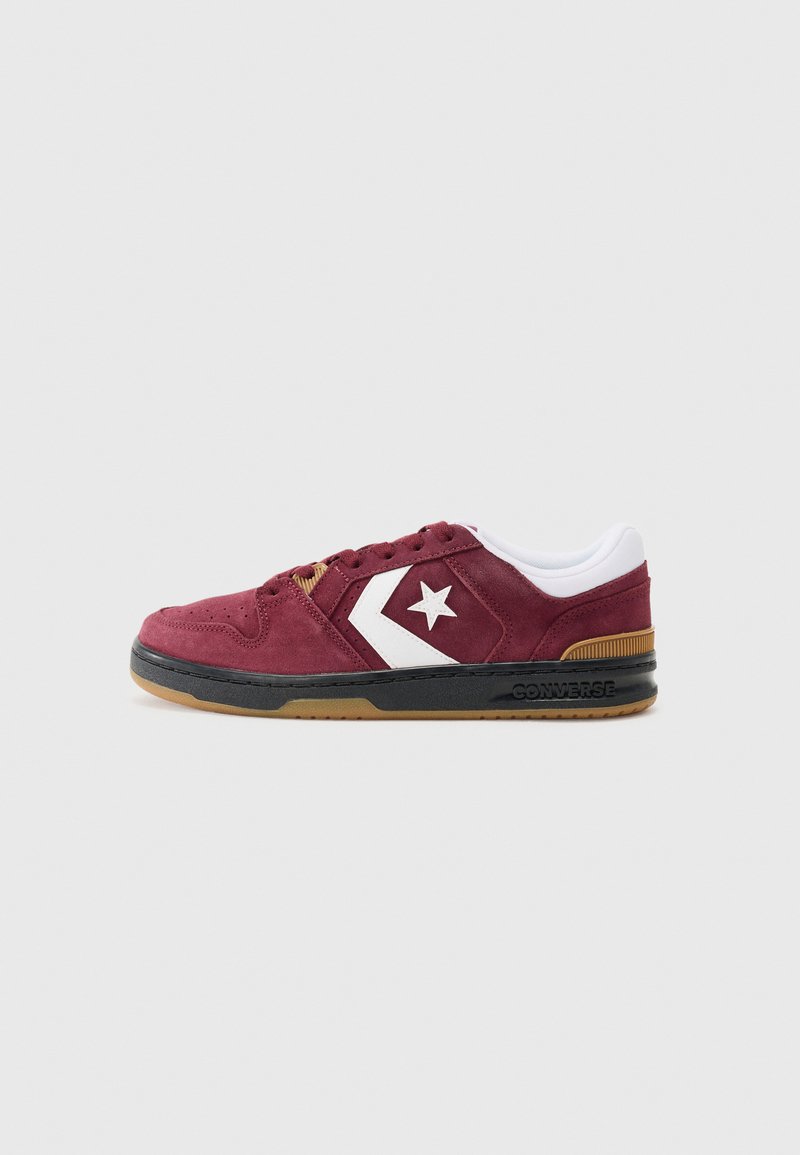 Maroon suede sneaker with white star logo, black sole, and gum outsole. Features white collar and laces, with decorative stitching details.