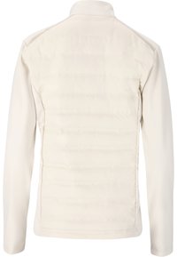 Ljusbeige jacka med en slät ytteryta och vadderad quiltad rygg. Har långa ärmar och en upprätt krage.