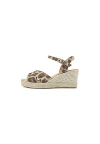 Leopard print wedge sandals with a woven jute heel, featuring an adjustable ankle strap and a soft fabric upper.