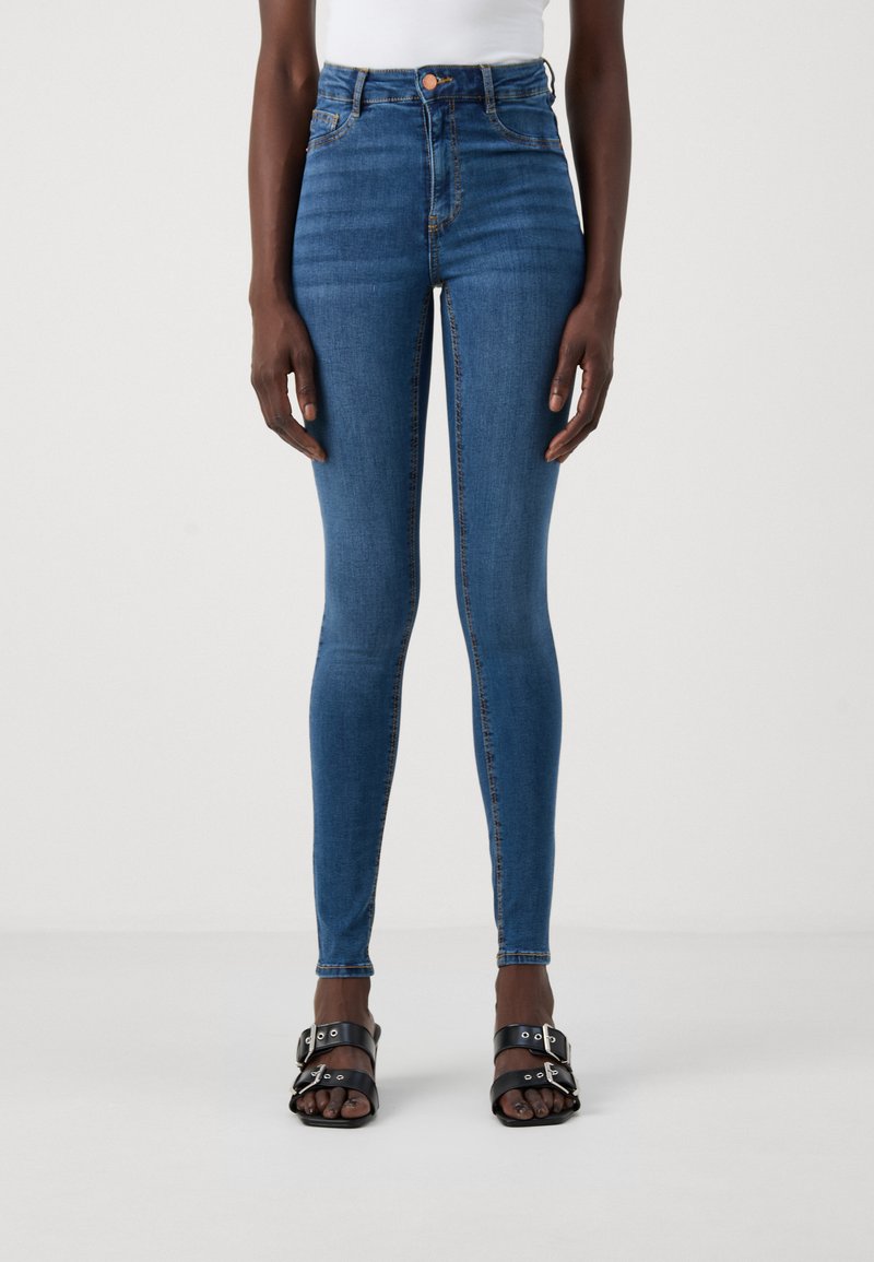 Høyt liv blå denimjeans med smal passform, med glidelås foran, knappelukking og subtile sømdetaljer.