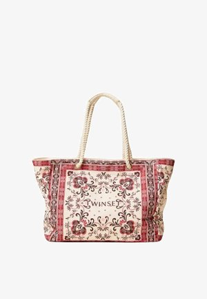 Borsa tote beige con motivi floreali rosa, manici a corda e scritta "TWINSET" al centro di una cornice decorativa.
