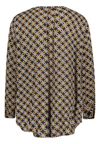 Bluzka z długim rękawem w granatowym kolorze, z geometrycznym wzorem żółtych i białych pierścieni. Miękka tekstura, luźny krój i zaokrąglony dół.