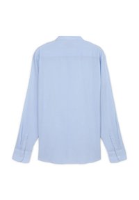 Camicia a maniche lunghe azzurro chiaro in un tessuto morbido, con colletto, polsini con bottoni e orlo dritto con design piatto sul retro.