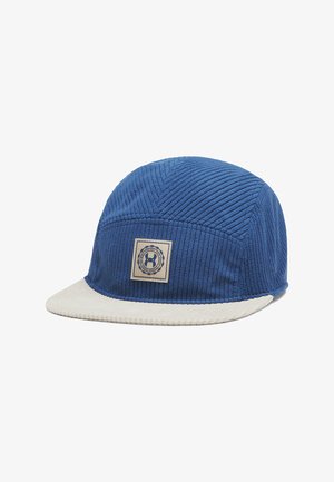 Blauwe gestructureerde stoffen pet met beige klep en vierkante logopatch aan de voorkant met een cirkelvormig ontwerp en een "H" in het midden.