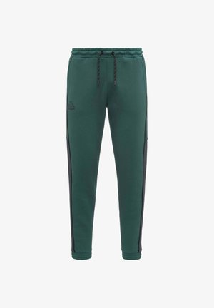 Pantalones de chándal verdes con paneles laterales negros, cinturilla elástica y cordón. Presenta el logo de Kappa en el frente, hechos de material suave.