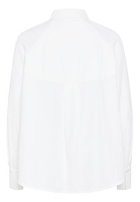 Chemise blanche à manches longues avec col, présentant un design de manches raglan, des plis dans le dos et des poignets boutonnés. Texture en coton lisse.