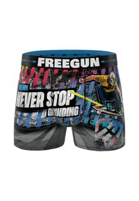 Un caleçon avec une ceinture élastique bleue, présentant un design graphique multicolore d'un skateur et le texte : "NE JAMais S'ARRÊTER DE GLISSER."