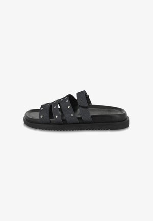 Black slide sandals with four textured fabric straps, featuring silver studs. The sole is flat and made from rubber for comfort.