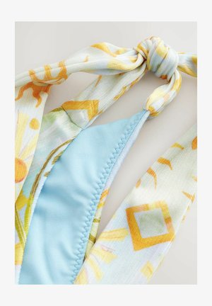 Bikini top with a light blue textured fabric and a multicolored, patterned tie with yellow and orange geometric designs.