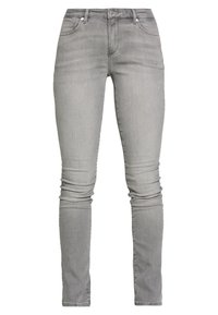 Jeans ajustados grises de denim, con un diseño clásico de cinco bolsillos, cinturilla estándar y un ligero desgaste en las piernas.