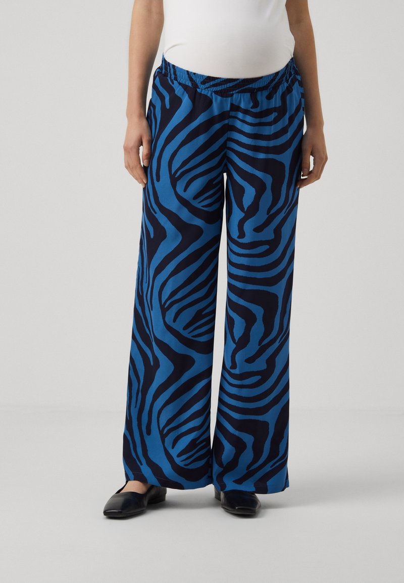 Blue and navy zebra print wide-leg pants with an elastic waistband, made of a soft, lightweight fabric, featuring a relaxed fit.