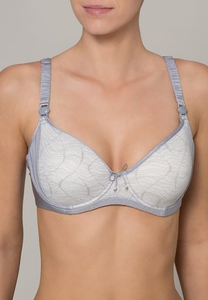 Light gray bra with a soft texture, featuring a wave pattern, adjustable straps, and a decorative bow at the center with small accents.