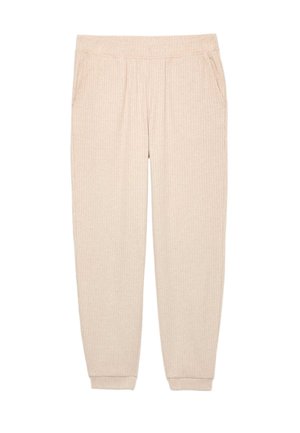 Béžové žebrované tepláky s jemnou strukturou, vybavené elastickým pasem a bočními kapsami. Zúžené nohavice s manžetami u kotníků.