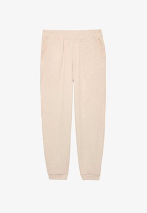 Béžové žebrované tepláky s jemnou strukturou, vybavené elastickým pasem a bočními kapsami. Zúžené nohavice s manžetami u kotníků.