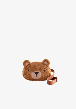 Brun børne skuldertaske formet som en bamse med smilende ansigt og justerbar rem på hvid baggrund.