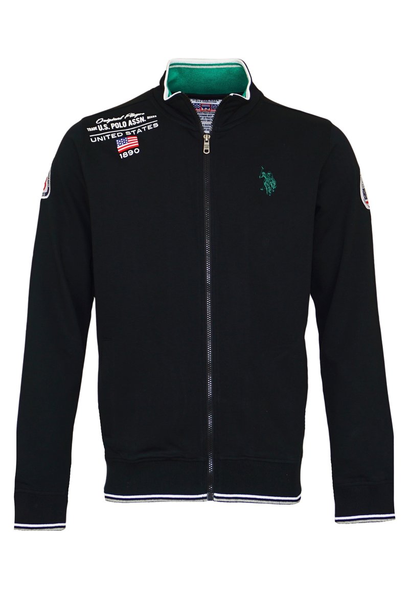 Schwarze Baumwolljacke mit Reißverschluss, ausgestattet mit einem grünen Kragen, weißen Streifen an den Bündchen und dem Saum sowie einem gestickten Logo auf der Brust.