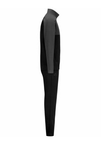 Completo sportivo nero e grigio scuro con colletto alto, maniche lunghe e pantaloni affusolati. Presenta tasche laterali e un logo discreto sulla gamba dei pantaloni.